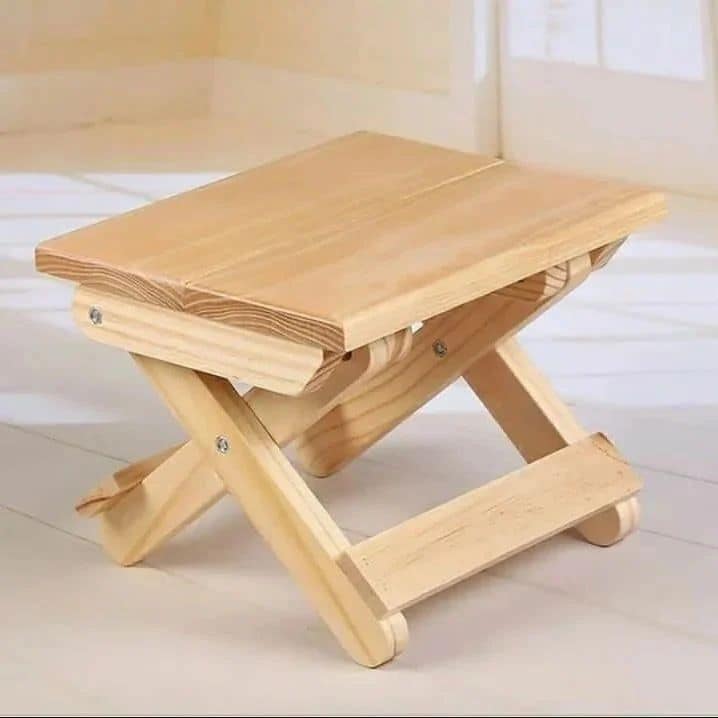 A wooden folding step stool