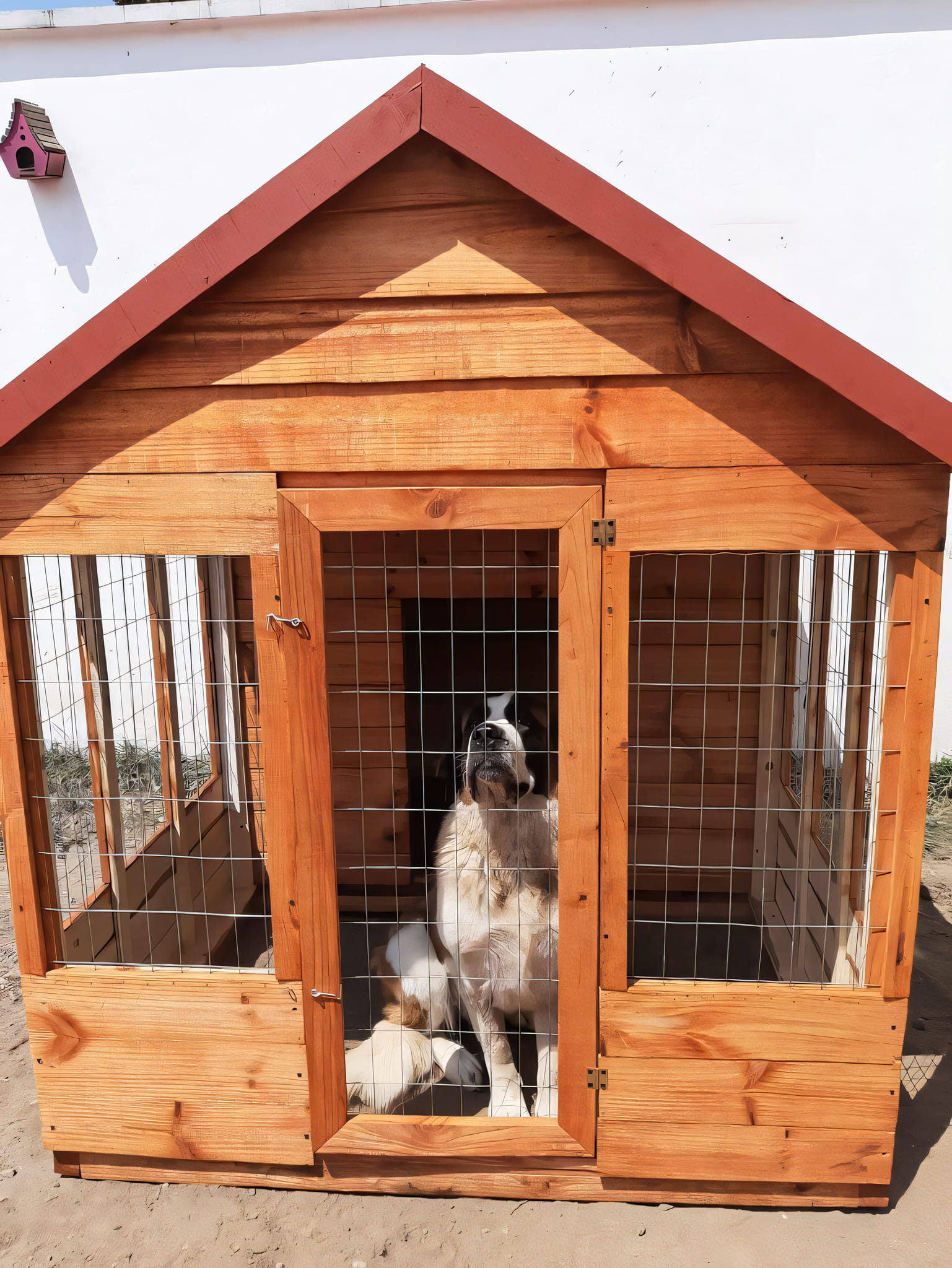 A finished wooden dog house outdoors